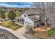 Beautiful home showcasing landscaped yard, charming porch, and mountain views at 11638 Xavier Way, Westminster, CO 80031
