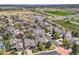 Aerial view showcasing the neighborhood homes with a community pond and walking trails at 11638 Xavier Way, Westminster, CO 80031