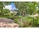 Charming backyard boasting a patio, beautiful landscaping, mature trees, and well manicured lawn at 11638 Xavier Way, Westminster, CO 80031
