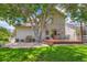 Expansive backyard featuring a wooden deck, patio seating, mature trees, and lush lawn at 11638 Xavier Way, Westminster, CO 80031