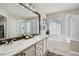 Luxurious bathroom with dual sinks, a soaking tub, and a separate glass-enclosed shower at 11638 Xavier Way, Westminster, CO 80031