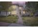 Inviting two-story home with stone accents, lush lawn, and a charming front porch at 11638 Xavier Way, Westminster, CO 80031