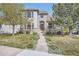 Charming two-story home featuring a stone facade, manicured lawn, and inviting walkway at 11638 Xavier Way, Westminster, CO 80031