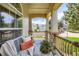 Relaxing front porch with comfortable seating and a charming neighborhood view at 11638 Xavier Way, Westminster, CO 80031