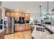 Spacious kitchen featuring wooden cabinets, stainless steel appliances, and granite countertops at 11638 Xavier Way, Westminster, CO 80031