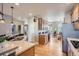Open concept kitchen featuring center island, wooden cabinets, and hardwood floors at 11638 Xavier Way, Westminster, CO 80031