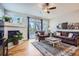Comfortable living room with a fireplace, large windows, and a stylish area rug at 11638 Xavier Way, Westminster, CO 80031