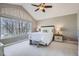 Bright main bedroom with a large window, soft carpet, and neutral decor at 11638 Xavier Way, Westminster, CO 80031