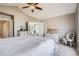 Spacious main bedroom leading to a bathroom, with a vaulted ceiling and large windows at 11638 Xavier Way, Westminster, CO 80031