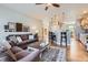 Open floorplan featuring a living room, kitchen, and dining area with hardwood floors at 11638 Xavier Way, Westminster, CO 80031