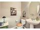 Charming powder room with a pedestal sink and decorative accents at 11638 Xavier Way, Westminster, CO 80031