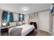 Spacious basement bedroom with king-size bed and fireplace at 7609 Sherman Pl, Denver, CO 80221