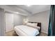 Simple basement bedroom with king-size bed and ensuite access at 7609 Sherman Pl, Denver, CO 80221