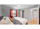 Bedroom with hardwood floors, a ceiling fan, and sliding door closet at 7609 Sherman Pl, Denver, CO 80221