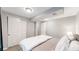 Cozy basement bedroom with a king-size bed and ample closet space at 7609 Sherman Pl, Denver, CO 80221