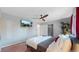 Comfortable bedroom with hardwood floors and a ceiling fan at 7609 Sherman Pl, Denver, CO 80221