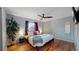 Spacious bedroom with hardwood floors and a ceiling fan at 7609 Sherman Pl, Denver, CO 80221