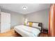 Spacious bedroom featuring a king-size bed and wood floors at 7609 Sherman Pl, Denver, CO 80221