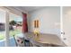 Small dining area with a table and chairs near a sliding glass door to the backyard at 7609 Sherman Pl, Denver, CO 80221