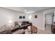 Comfortable living room with a brown leather couch and a coffee table at 7609 Sherman Pl, Denver, CO 80221