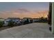 Large backyard with an oversized patio and iron fence, offering stunning sunset views at 26656 E Peakview Dr, Aurora, CO 80016