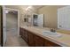 Bright bathroom featuring double sinks and a vanity with granite countertops at 26656 E Peakview Dr, Aurora, CO 80016