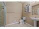 Bathroom with tiled floor, white toilet and vanity, and a stand up shower at 26656 E Peakview Dr, Aurora, CO 80016