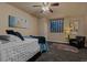 Bedroom featuring a ceiling fan, window, and carpeted floor at 26656 E Peakview Dr, Aurora, CO 80016