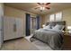 Bedroom featuring a ceiling fan, window, and carpeted floor at 26656 E Peakview Dr, Aurora, CO 80016