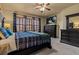 Bedroom featuring a ceiling fan, window, and carpeted floor at 26656 E Peakview Dr, Aurora, CO 80016