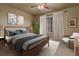 Comfortable bedroom with stylish decor, a ceiling fan, and a window with curtains at 26656 E Peakview Dr, Aurora, CO 80016
