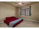 Neutral bedroom featuring a ceiling fan, window, and carpeted floor at 26656 E Peakview Dr, Aurora, CO 80016