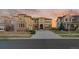 Charming two story stucco home with a concrete driveway and a meticulously maintained front lawn at 26656 E Peakview Dr, Aurora, CO 80016