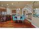 Open-concept kitchen with stainless appliances, a breakfast nook, and hardwood floors at 26656 E Peakview Dr, Aurora, CO 80016