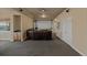 Open living room featuring theater screen and built-in bar area, neutral paint and plush carpet at 26656 E Peakview Dr, Aurora, CO 80016