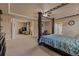 Expansive main bedroom suite with ample seating, a tray ceiling, generous space, and carpeted floors at 26656 E Peakview Dr, Aurora, CO 80016