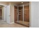 Walk-in shower featuring a glass enclosure and tiled walls at 26656 E Peakview Dr, Aurora, CO 80016