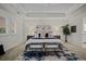 Main bedroom with carpeted floors and tray ceiling at 10423 Isle St, Parker, CO 80134