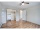 Bright bedroom with wood floors, closet organizers, and neutral paint at 27857 Apex Cir, Evergreen, CO 80439
