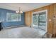 Open dining area with tile floors, natural light, and a sliding door to the deck at 27857 Apex Cir, Evergreen, CO 80439