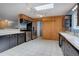 Kitchen with stainless steel appliances, white countertops, and tile flooring at 27857 Apex Cir, Evergreen, CO 80439