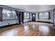 Bright living room featuring beautiful wood flooring and windows with outdoor views at 27857 Apex Cir, Evergreen, CO 80439