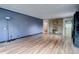 This is a spacious living room, enhanced by wood-look floors, stone fireplace, and ample light at 27857 Apex Cir, Evergreen, CO 80439