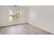 Bright bedroom with wood-look floors and large window at 10212 W 80Th Dr # D, Arvada, CO 80005