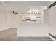 Modern white kitchen with a breakfast bar and updated appliances at 10212 W 80Th Dr # D, Arvada, CO 80005