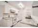 Updated kitchen featuring white cabinets and granite at 10212 W 80Th Dr # D, Arvada, CO 80005