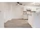 Modern white kitchen with granite countertops at 10212 W 80Th Dr # D, Arvada, CO 80005