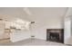 Bright living room with fireplace and vaulted ceiling at 10212 W 80Th Dr # D, Arvada, CO 80005