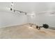 Unfinished basement with concrete floor and white walls, featuring an exercise machine at 1482 S Lansing St, Aurora, CO 80012