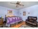 This is a bright bedroom with hardwood floors, a ceiling fan, and a relaxing atmosphere at 1482 S Lansing St, Aurora, CO 80012